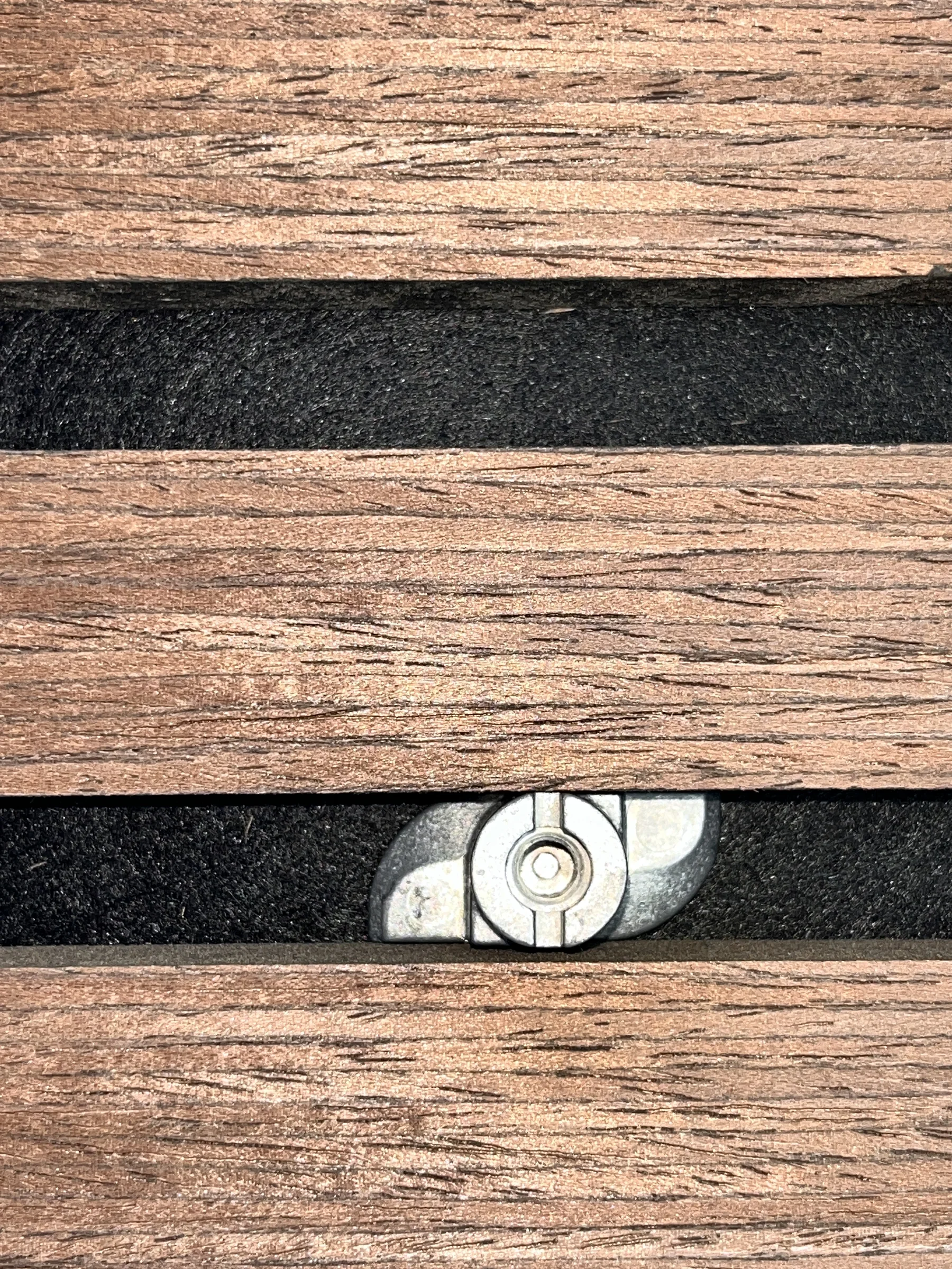 Mounting base positioned on wood slat